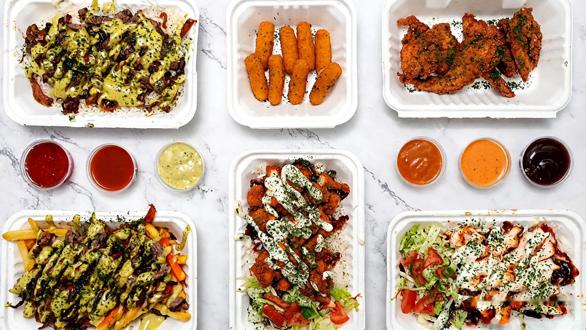 A Rice Bros spread: loaded rice bowls, chicken tenders, mozzarella sticks and dips